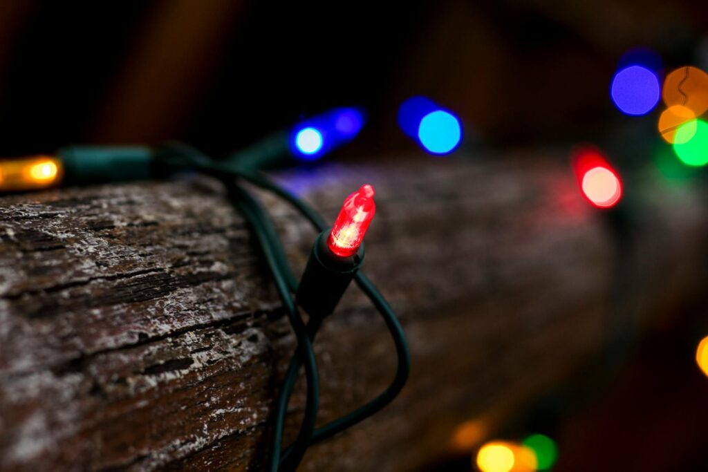 Lit Christmas logs on a log