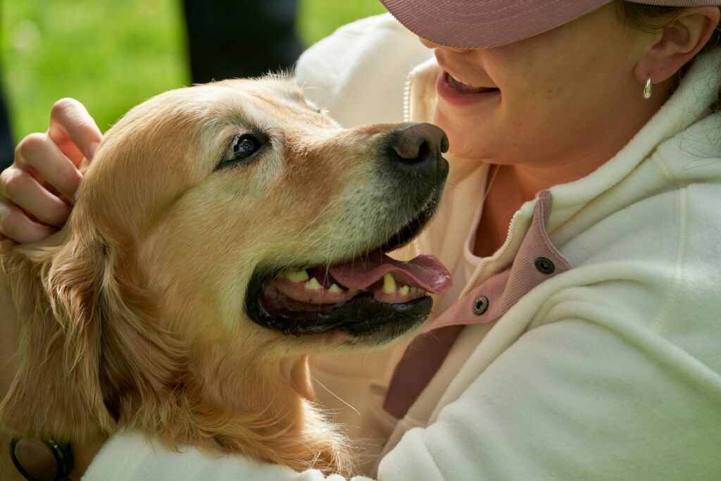 A person holding a dog